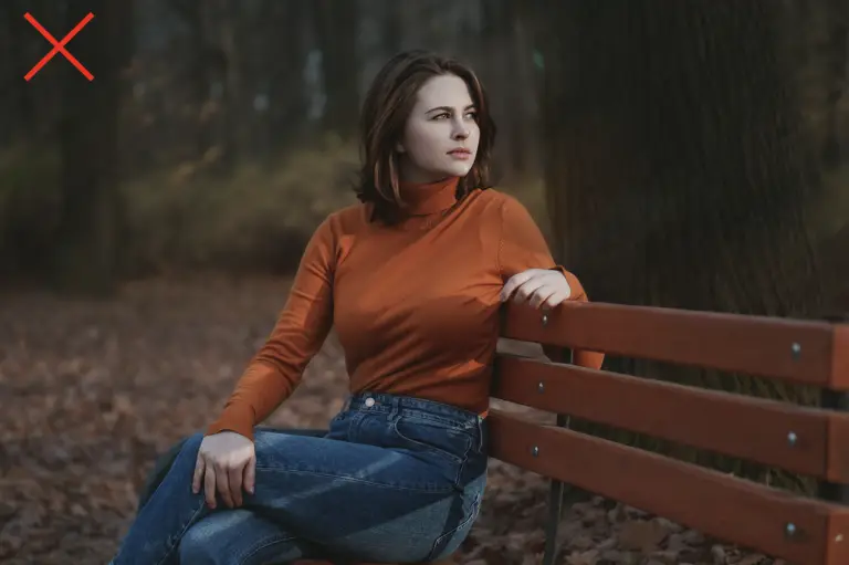 Woman wearing an orange turtleneck shirt that is not ideal for petite women.