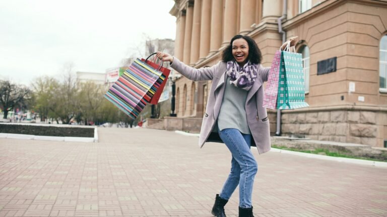Happy and Confident Young Petite Woman Having Success Shopping