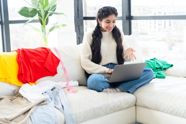Happy young woman enjoying online shopping on her laptop and choosing items with excitement.